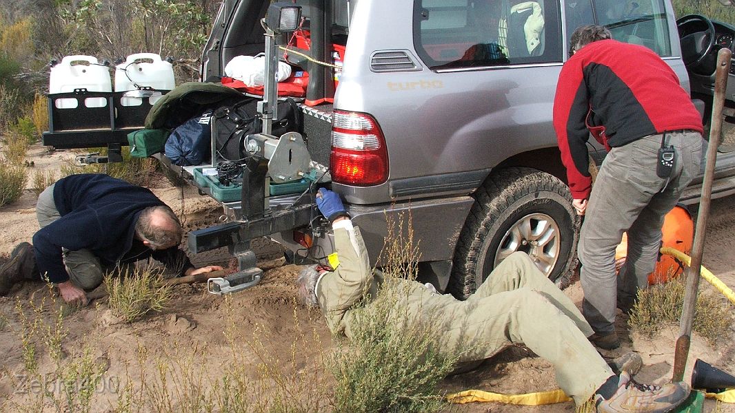 16-All hands on deck to fix a staked tyre.JPG